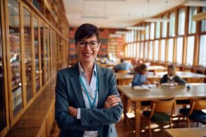 happy female professor during a class at high school looking at camera