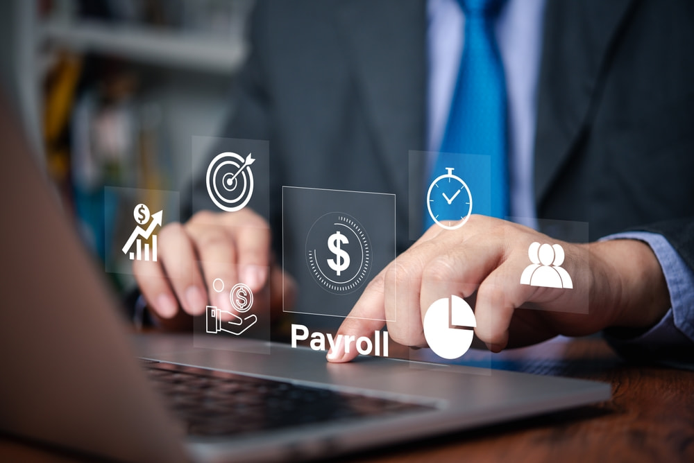 Businessman managing payroll system