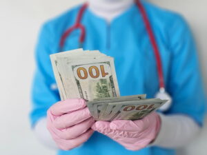 doctor hands count dollars