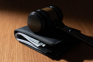 Gavel on top of a wallet